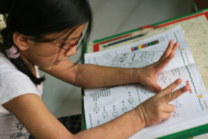 Girl Doing Math - 4415231879_d7f272a90b_b
