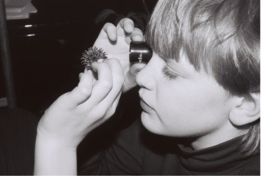 child-looking-through-magnifying-loupe